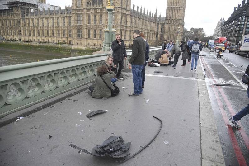 Injured people are assisted after an incident on Westminster Bridge in London