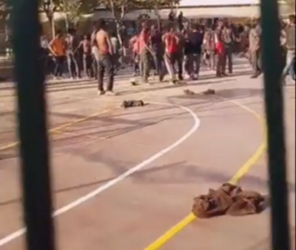 MELILLA (ESPAÑA), 21.10.2018. Vista de los migrantes celebrando su llegada a España, tras asaltar la valla de Melilla. boza, boza. Ñ Pueblo