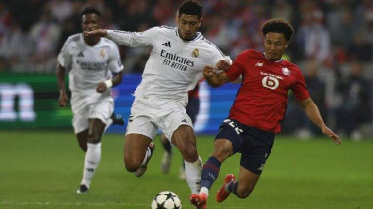 FOTOGRAFÍA. LILLE (FRANCIA), 02 DE OCTUBRE DE 2024. El jugador del Lille Tiago Santos (d) en acción ante el inglés del Madrid Jude Bellingham durante el partido de la segunda jornada de la Liga de Campeones que juegan Lille y Real Madrid en Lille, Francia. Efe