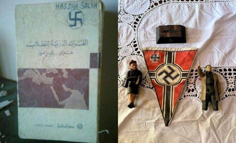 FOTOGRAFÍA. AITA AL-SHAAB (SUR DEL LÍBANO), 01 DE NOVIEMBRE DE 2024. Las Fuerzas de Defensa de Israel (FDI), integrantes del Ejército de la Tierra Santa (Tzáhal), han dado con un nuevo hallazgo que confirma el islamofascismo de los grupos antisemitas que conforman la cruzada anti-israelí liderada por la tiranía de los ayatolás —junto a sus aliados de la antiIsrael en el Occidente- desde la República Islámica de Irán hasta el Oriente Medio: en la Franja palestina de Gaza, con el Hamas ISIS, y en el sur del Líbano, con el Hezbolá ISIS. Se trata de cuadernos de adoctrinamiento nazi y bandera nazi con su cruz gamada (la esvástica); de muñecos SS, —los llamados "Schutzstaffel", organización paramilitar y política al servicio del líder del nazismo y del Tercer Reich alemán, Adolf Hitler, y al servicio del Partido Nacionalsocialista Obrero Alemán (NSDAP) en la Alemania nazi; también conocidos como "Einsatzgruppen" o "grupos operativos" o también «grupos de operaciones», que simplemente eran un conjunto de escuadrones de ejecución itinerantes especiales de la Alemania Nazi; unos escuadrones de la muerte que actuaron en Austria de 1938, Checoslovaquia (1939), en Polonia (1939) y la Unión de Repúblicas Socialistas Soviéticas (URSS) en 1941 masacrando masivamente en cámaras de gas o fusilamientos grupales a los civiles judíos, pegando primero el tiro en la nuca de los niños, que sus padres estaban obligados a levantarlos lo más arriba posible, y después fusilando a los padres de los críos—; entre otros, objetos como cajas de adorno siempre con la esvástica fascista, capturados por los guerreros santos durante la operación terrestre en contra el "enemigo" terrorista en el sur del Líbano: el Hezbollah (Hezbolá). Tzáhal/Lasvocesdelpueblo (Ñ Pueblo)