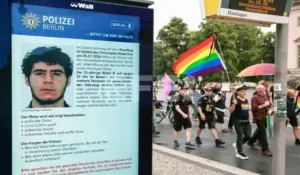 FOTOGRAFÍA. BERLIN (GERMANY), 26 OF JULY OF 2026. Alemania, abatido el islamista Abdul Ballout autor de la masacre de LGTBI. People attending a mourning march following a car-ramming attack near the Christopher Street Day (CSD) parade route pass an electronic display showing a police appeal for information about suspected perpetrator Abdul Rahman Toufic Ballout (Abdul Ballout in Berlin, Germany, 26 July 2026. Police said the suspect was believed to be linked to Islamist circles, while German Interior Minister Alexander Dobrindt said the 25 July vehicle ramming, which killed one person and injured 29 others, is being investigated as a terrorist attack. Efe